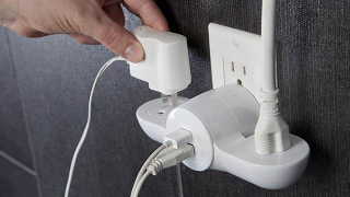Illustration for article titled Portable Pivoting Power Adapter Maximizes Your Hotel's Outlets